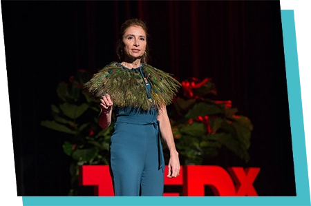 Jennifer Fondrevay speaking at TedX in blue